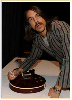 Post thumbnail of RHCP signed Guitar Up for Auction